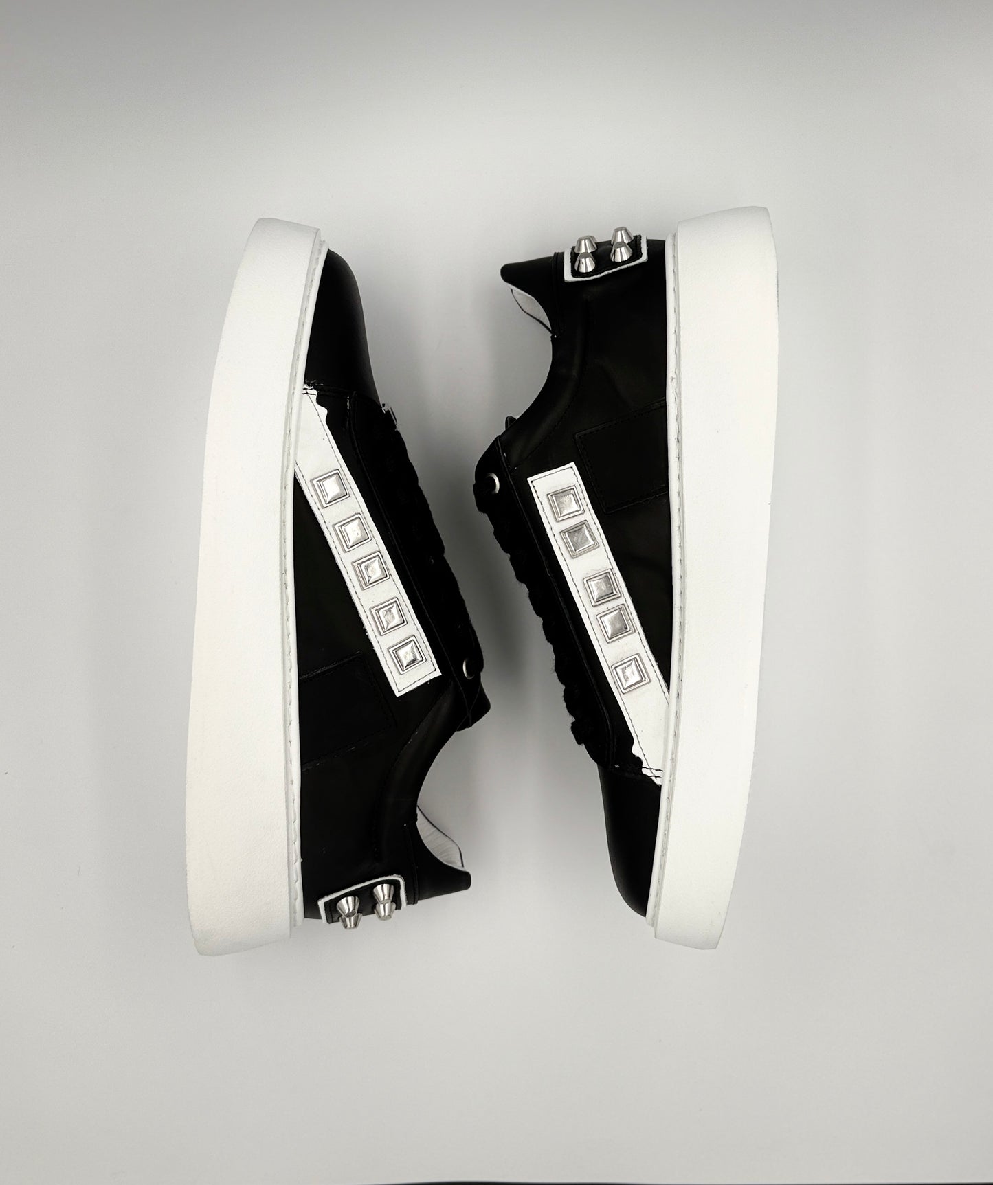 “VELOCE” LOW-TOP SNEAKERS IN BLACK LEATHER WITH WHITE DETAILING AND STUDS